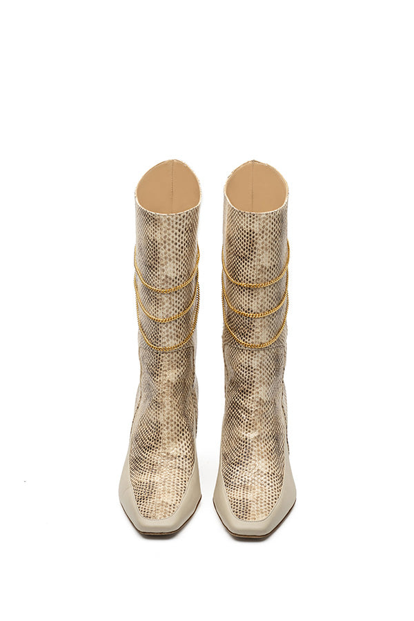 Femme Liberee Naomi Print Python leather boots shot from the front on white background