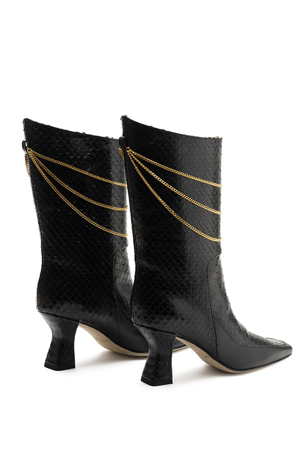 Naomi Black Python Print high heel black boots shot at angle from the back on white background