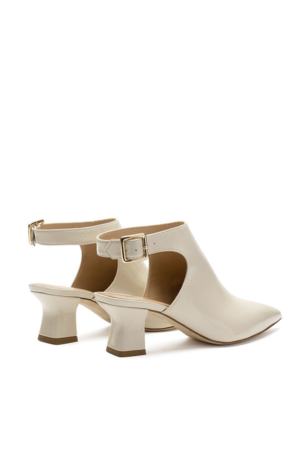 Gisele Pearl White Lack Buckle Shoes for woman shot from behind at an angle on a white background