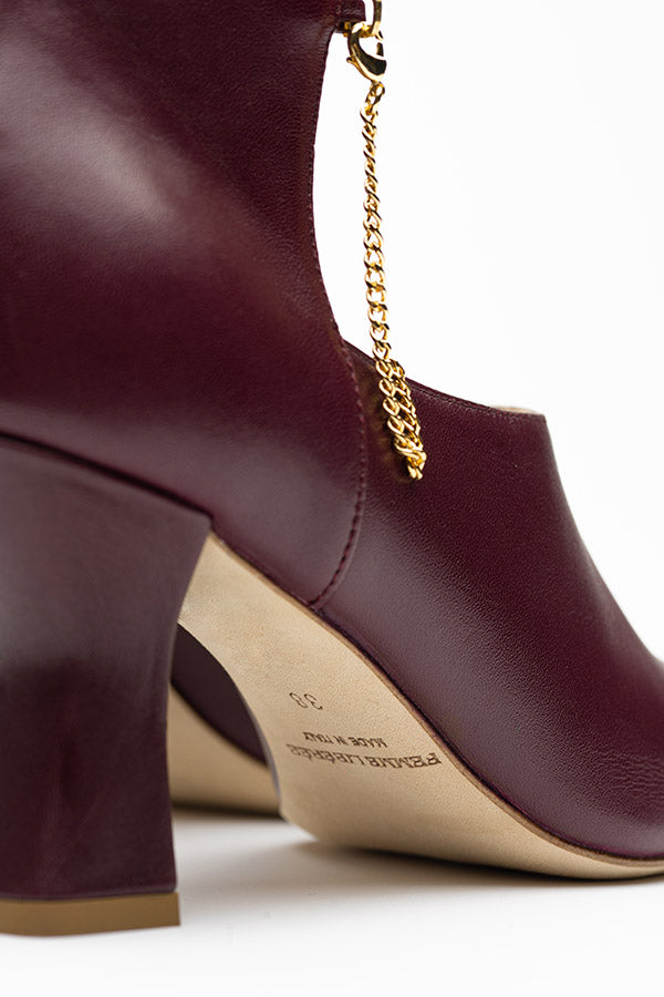 Kate boot shoes for ladies zoom in on the side of the shoe and shot from the back at an angle on a grey background