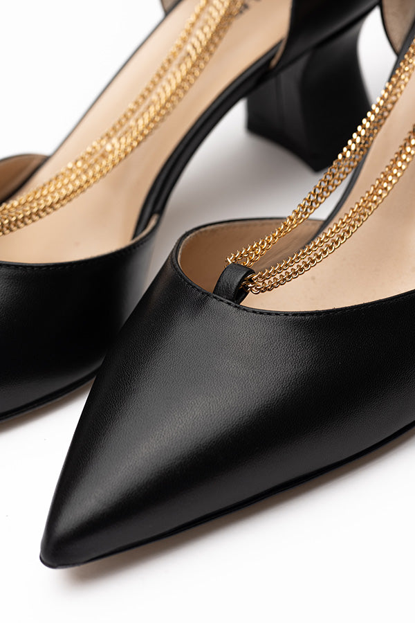 Elegant shoes for white dress Linda Black D'orsay zoom in with one shoe in foucs shot from above at an angle on a white background