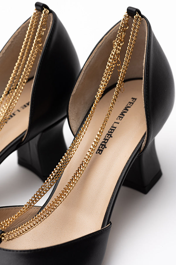 Two Linda Black Dorsay Shoes when only one is in focus zoom in on the inside of the shoe on shot at angle on a white background