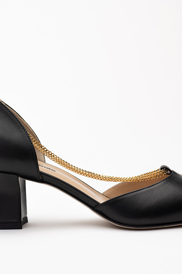 The middle of the Linda Black D'orsay shoe shot from the side on a white-grey background