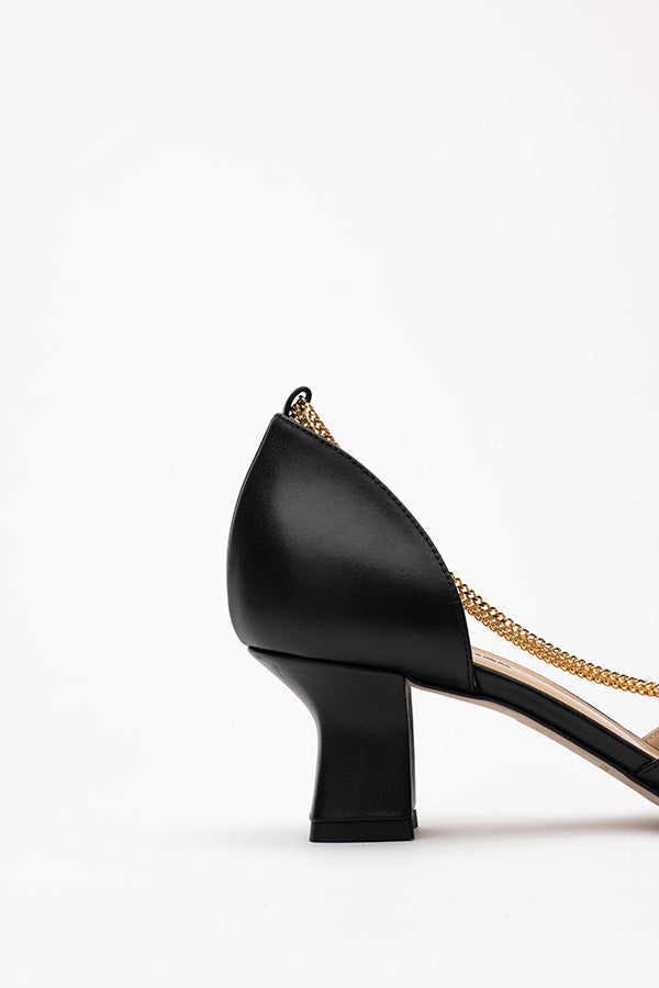 The 50 mm heel of the Linda Black D'orsay shoe shot from the side on whitee-grey background