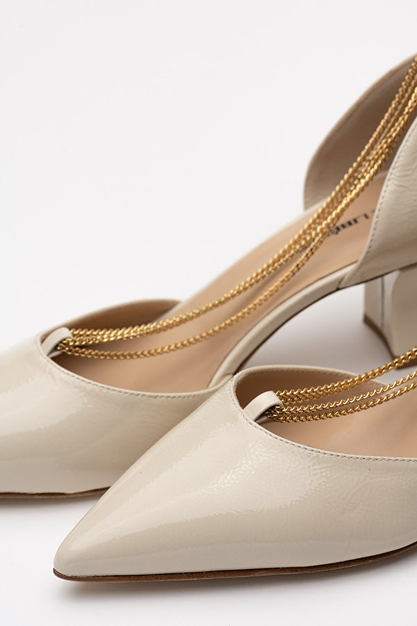 Toe cap of the Linda Pearl White Lack D'orsay shoes shot at an angle and infront