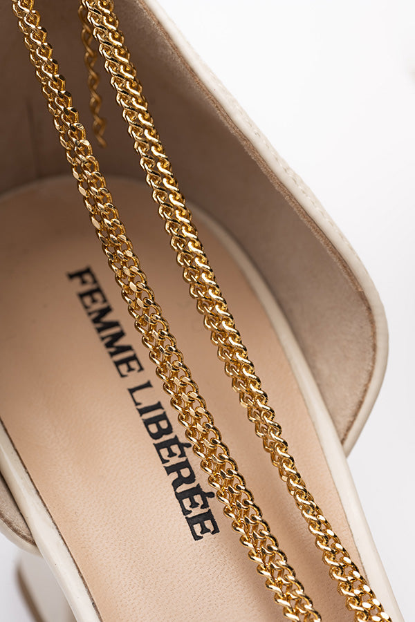 zoom in at an angle on the inside of the white d'orsay femme shoe