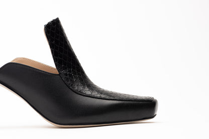 Black Mule shoe (Sideshot) sole on a white background