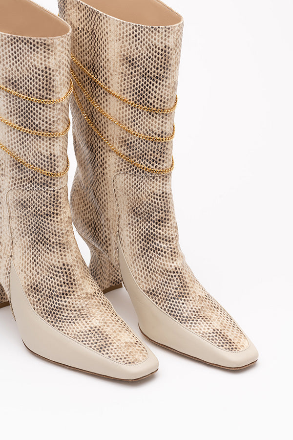 Naomi Ivory Python print boot calf high boots women shot from the front at an angle on white background