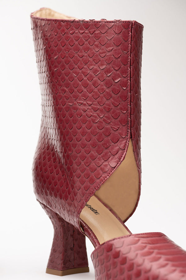 Shot at an angle from the front of Tyra red boots women Python Print OpenBoot