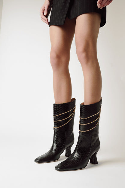 woman legs with black leather mid calf boot Naomi Black Python Print
